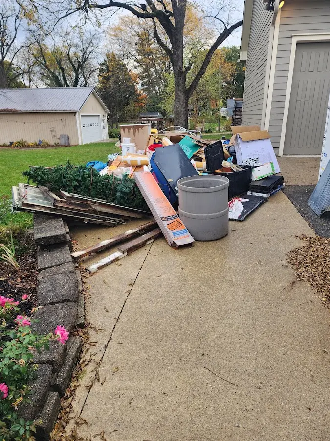 Dumpster being loaded with debris for Estate Cleanout Dumpster Rental in Susanville